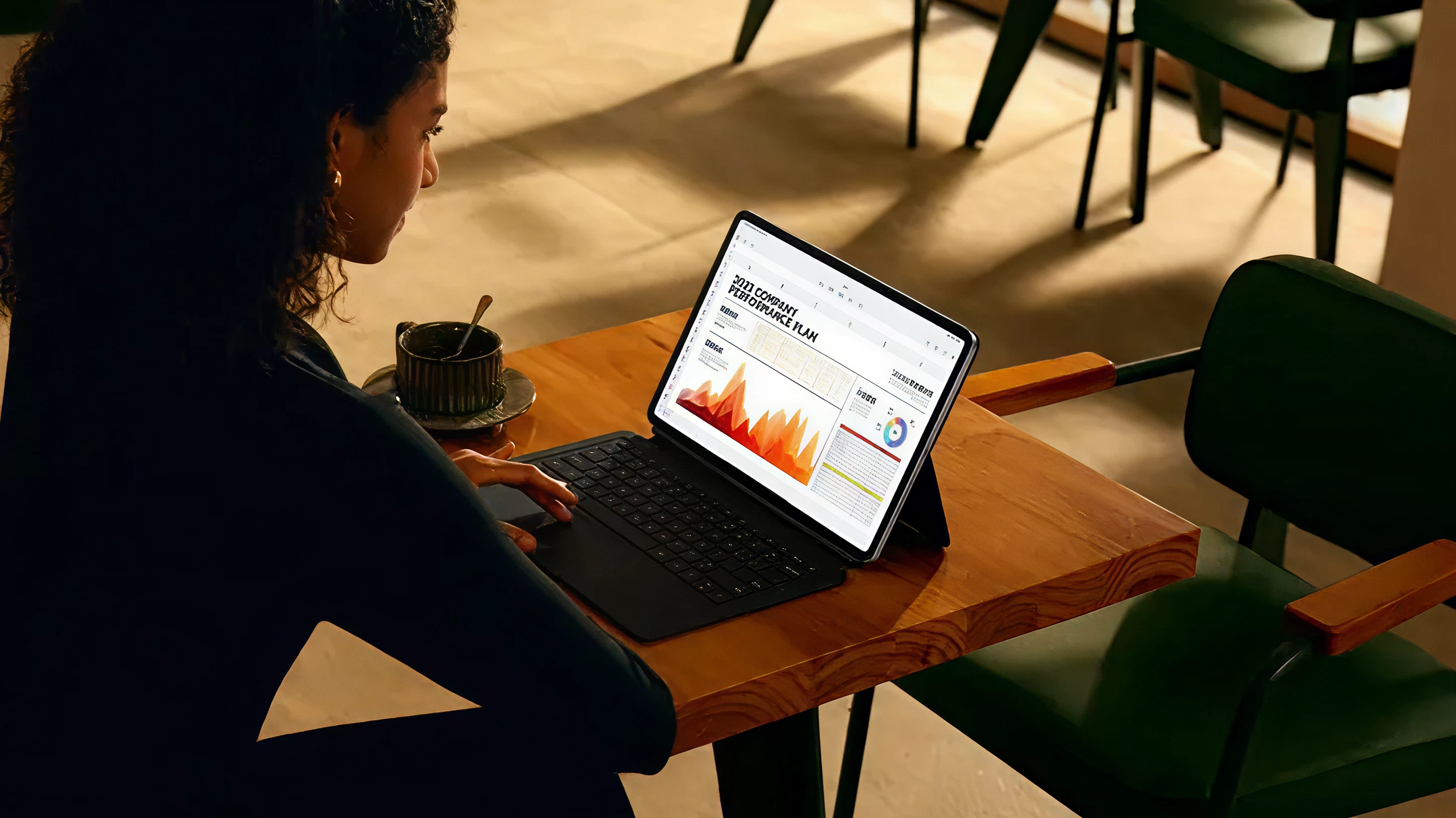 Restaurant manager reviewing analytics on tablet
